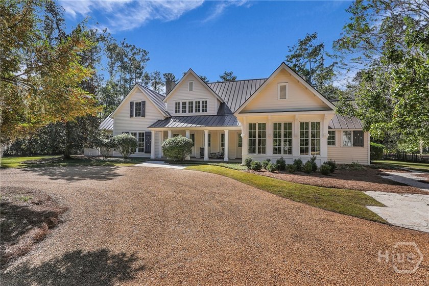 Tucked within this exclusive community, this 4-bed, 4-full & - Beach Home for sale in Richmond Hill, Georgia on Beachhouse.com