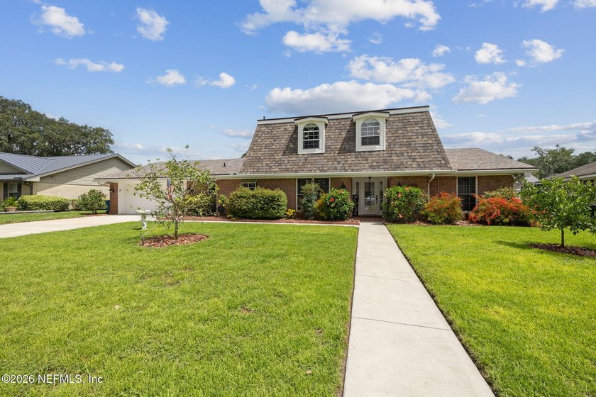 Waterfront living w/navigable access & modern comfort in this - Beach Home for sale in Jacksonville, Florida on Beachhouse.com