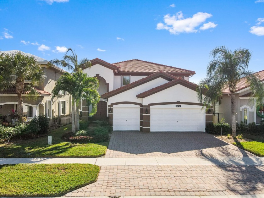 Nestled in a gated community in western Lake Worth, this - Beach Home for sale in Lake Worth, Florida on Beachhouse.com