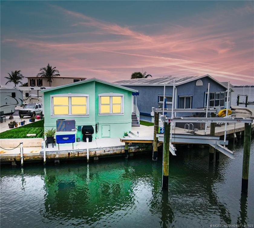 Island Waterfront home with 16k pound boat lift and composite - Beach Home for sale in Jensen Beach, Florida on Beachhouse.com