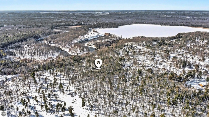 Discover a rare 8.5-acre retreat overlooking the beautiful Au - Beach Acreage for sale in Oscoda, Michigan on Beachhouse.com