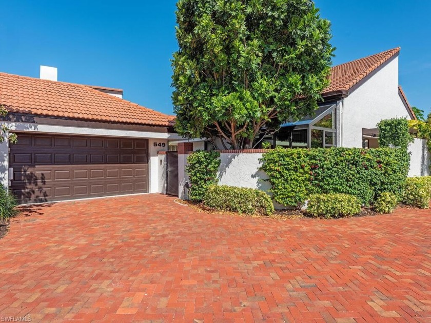 Nestled within highly sought-after Bay Villas at Pelican Bay - Beach Home for sale in Naples, Florida on Beachhouse.com