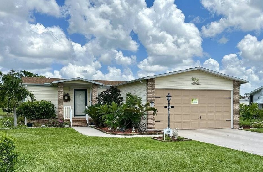 Lovely home located on a cul-de-sac with lake and water views - Beach Home for sale in North Fort Myers, Florida on Beachhouse.com