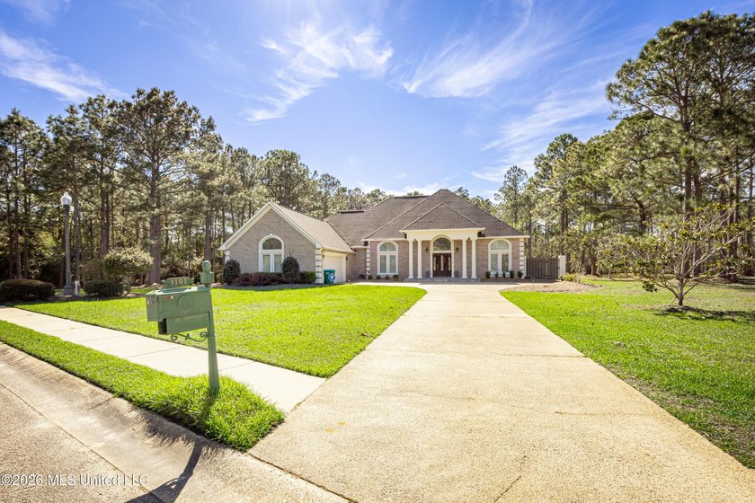Located in a prestigious gated golf course community, this - Beach Home for sale in Gautier, Mississippi on Beachhouse.com