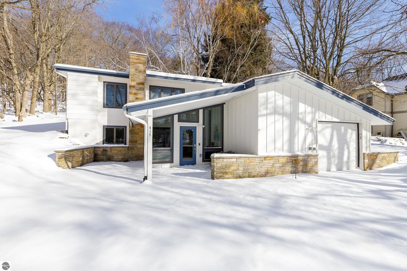 Discover this beautifully renovated 4-bedroom, 2-bath - Beach Home for sale in Frankfort, Michigan on Beachhouse.com