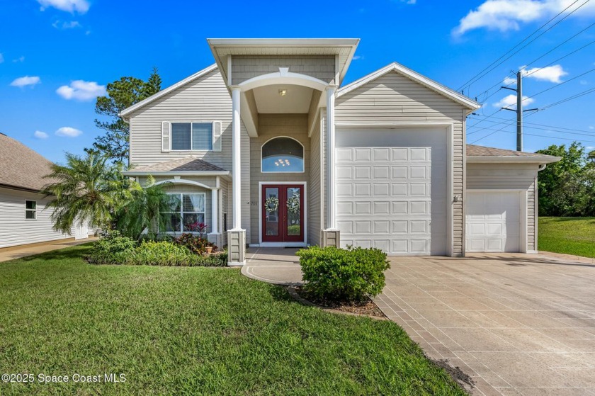 Park your RV in the enclosed garage within your luxurious 3/3 - Beach Home for sale in Titusville, Florida on Beachhouse.com