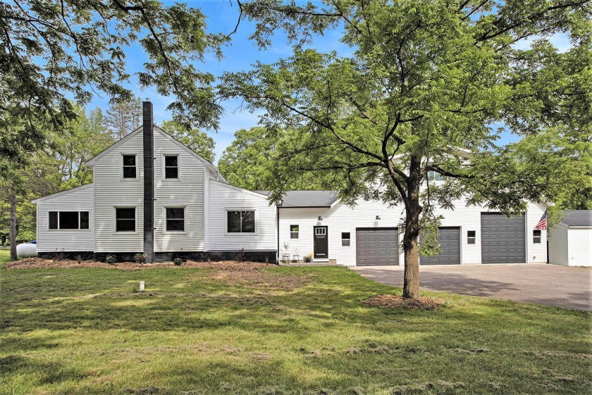 This UPDATED modern home is a CAR/HOBBY ENTHUSIASTS DREAM w/a - Beach Home for sale in Vicksburg, Michigan on Beachhouse.com