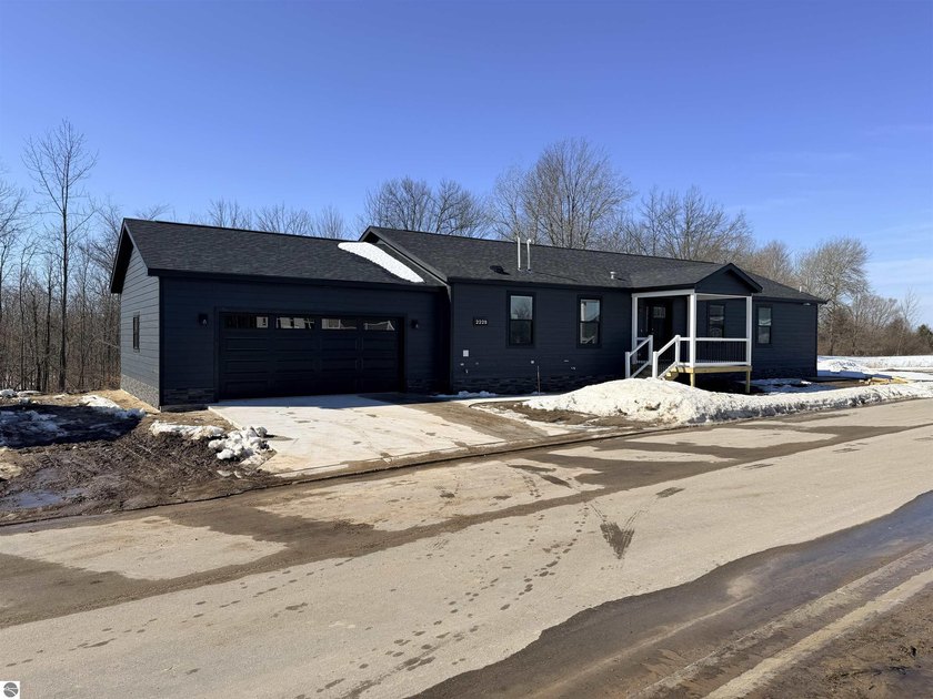 This modern home is nestled in the center of the community and - Beach Home for sale in Traverse City, Michigan on Beachhouse.com
