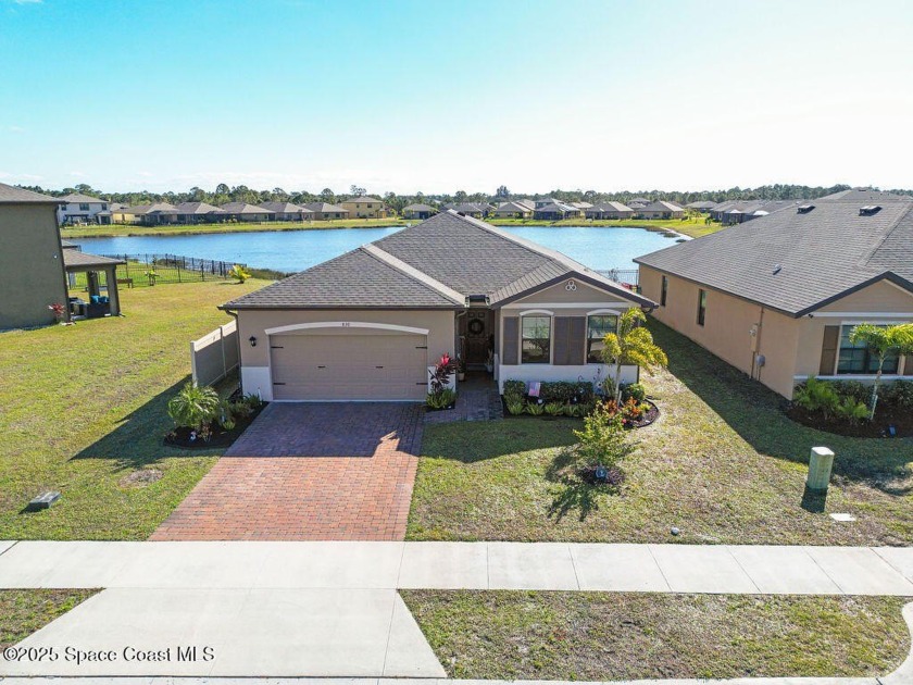Welcome to this stunning 2022-built home featuring a modern open - Beach Home for sale in Palm Bay, Florida on Beachhouse.com