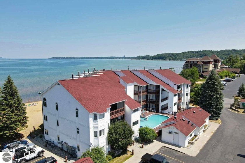 Welcome to this fully furnished, beautifully updated beachfront - Beach Condo for sale in Traverse City, Michigan on Beachhouse.com