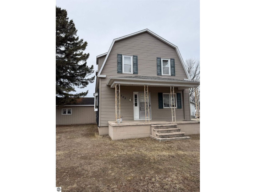 This classic Colonial home offers the perfect blend of location - Beach Home for sale in Tawas City, Michigan on Beachhouse.com