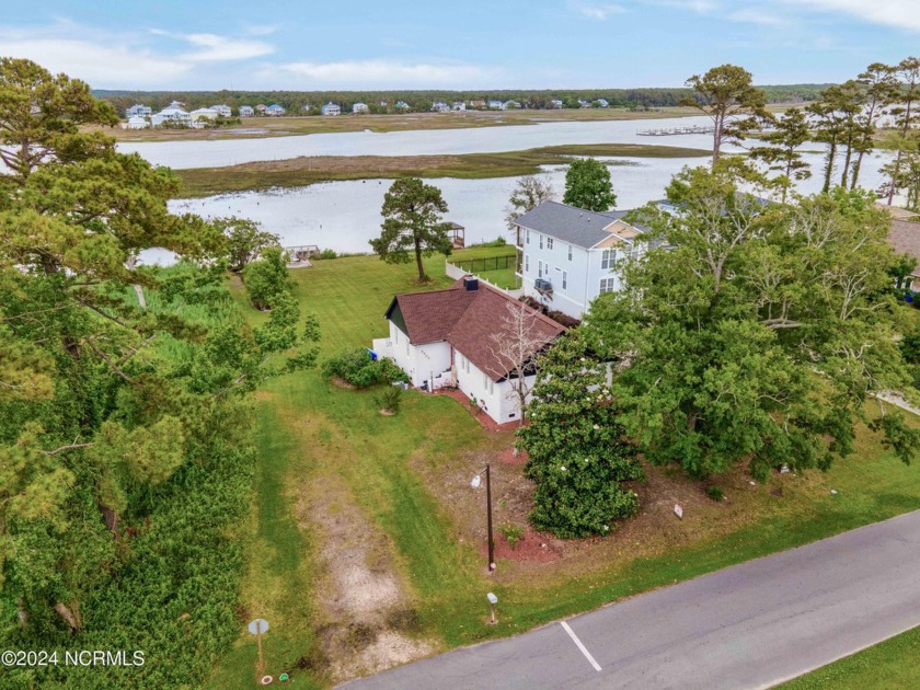 Experience waterfront living at its finest at 5802 E Yacht Drive - Beach Home for sale in Oak Island, North Carolina on Beachhouse.com