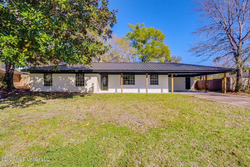 Step inside to discover a bright, open-concept layout featuring - Beach Home for sale in Long Beach, Mississippi on Beachhouse.com