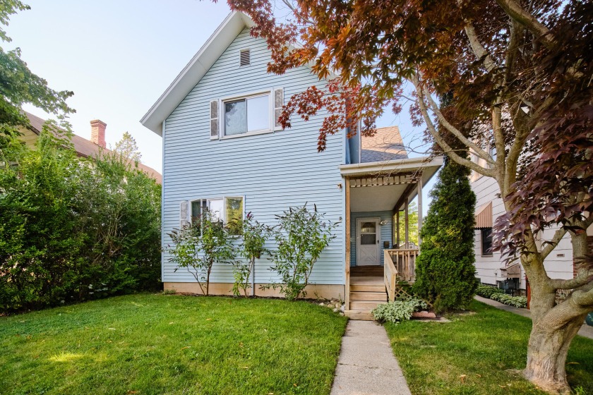 Welcome to this charming 3-bedroom, 2-bath home in the heart of - Beach Home for sale in Manistee, Michigan on Beachhouse.com