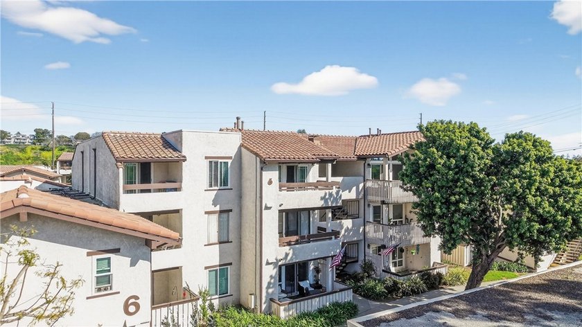 Located minutes to the beach in desirable gated community of Sea - Beach Condo for sale in Huntington Beach, California on Beachhouse.com