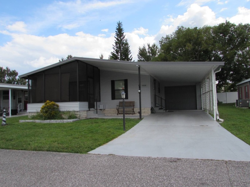 2 BED 2 BATH ON PERIMETER WITH LONG DRIVEWAY AND FULL GARAGE - Beach Home for sale in Trinity, Florida on Beachhouse.com