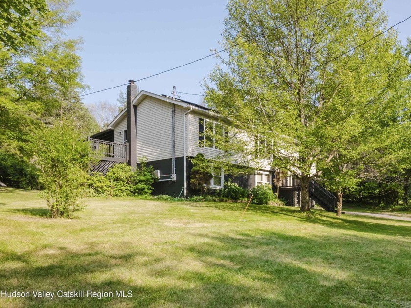 This updated 3-bedroom, 2-bath home is nestled on a beautifully - Beach Home for sale in Saugerties, New York on Beachhouse.com