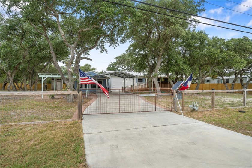 Nestled in a park-like setting on .5 acre lot with mature oak - Beach Home for sale in Rockport, Texas on Beachhouse.com