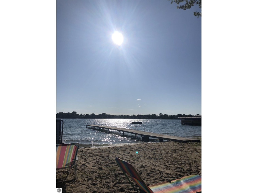 Nestled along the shores of beautiful Silver Lake, this - Beach Home for sale in Traverse City, Michigan on Beachhouse.com