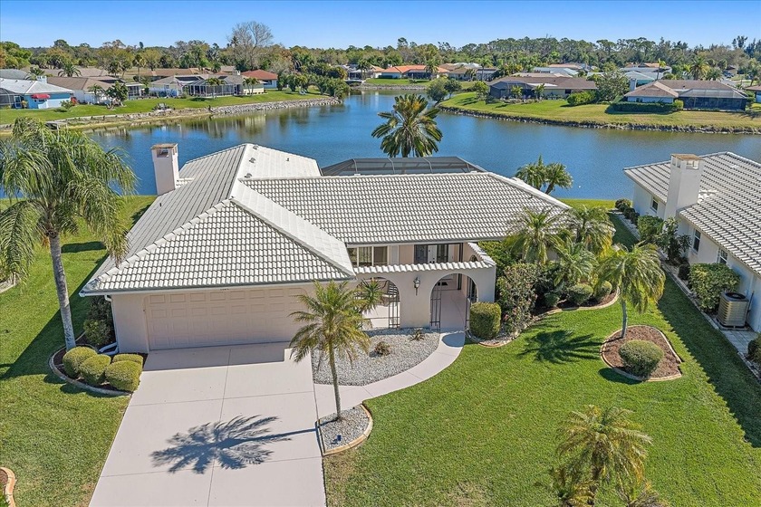 PANORAMIC LAKE VIEWS! This quality constructed model home built - Beach Home for sale in Venice, Florida on Beachhouse.com