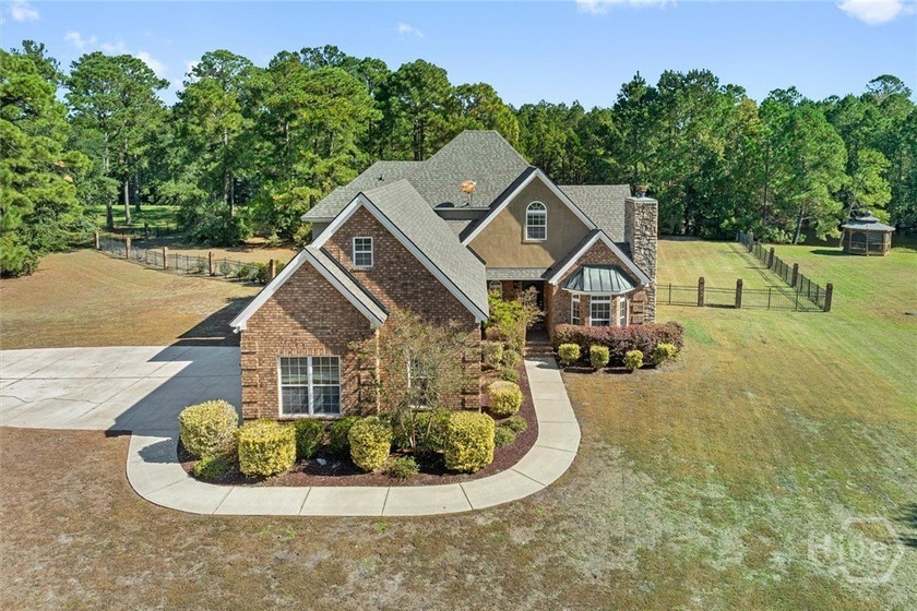 Set on a picturesque 2.5 acre lot, this stunning 3 bedroom, 2.5 - Beach Home for sale in Richmond Hill, Georgia on Beachhouse.com