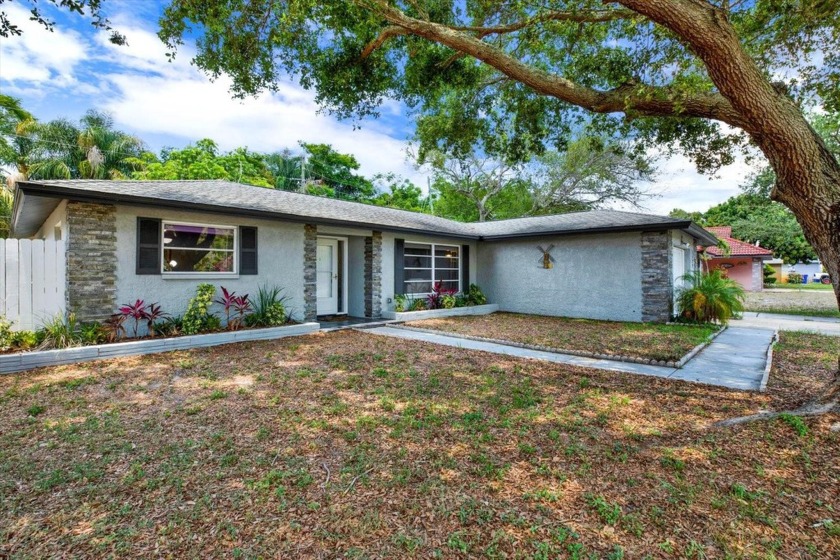 The best location! Beautifully updated one-story home in a - Beach Home for sale in Clearwater, Florida on Beachhouse.com