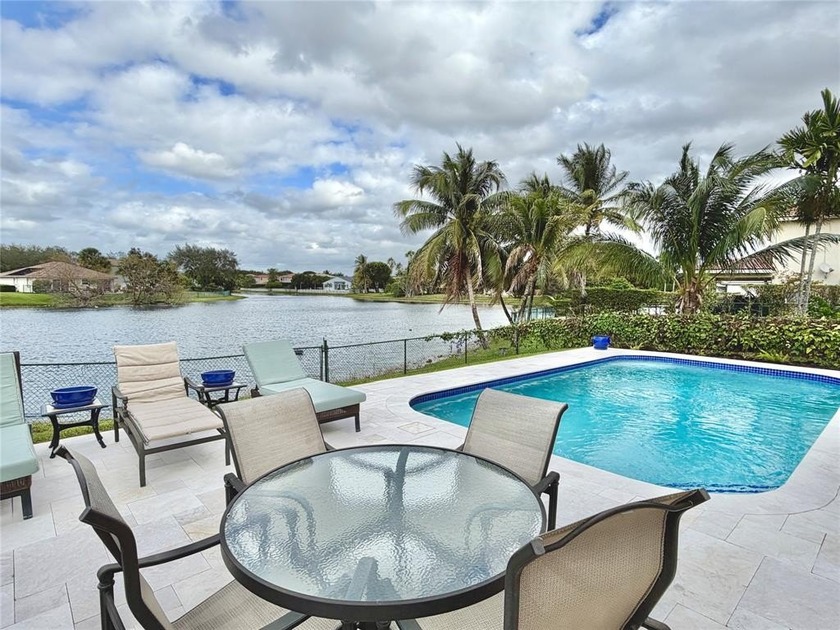 Elegant lakefront single-story & pool residence within the gated - Beach Home for sale in Miramar, Florida on Beachhouse.com