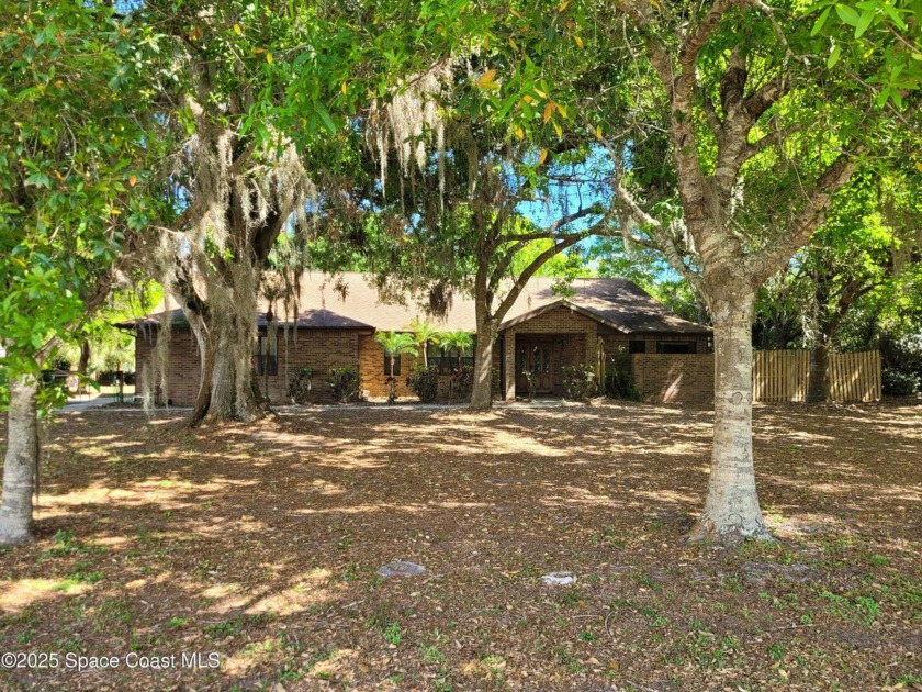 UNLOCK THE POTENTIAL on this home situated on a BEAUTIFUL LOT on - Beach Home for sale in Merritt Island, Florida on Beachhouse.com