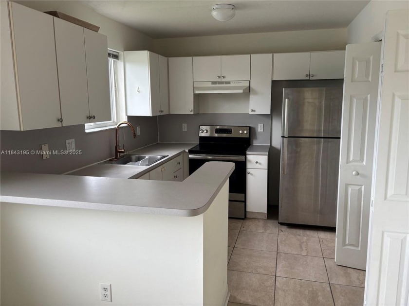 Spacious 3-bedroom, 2-bath condo corner unit with lake view that - Beach Condo for sale in Homestead, Florida on Beachhouse.com