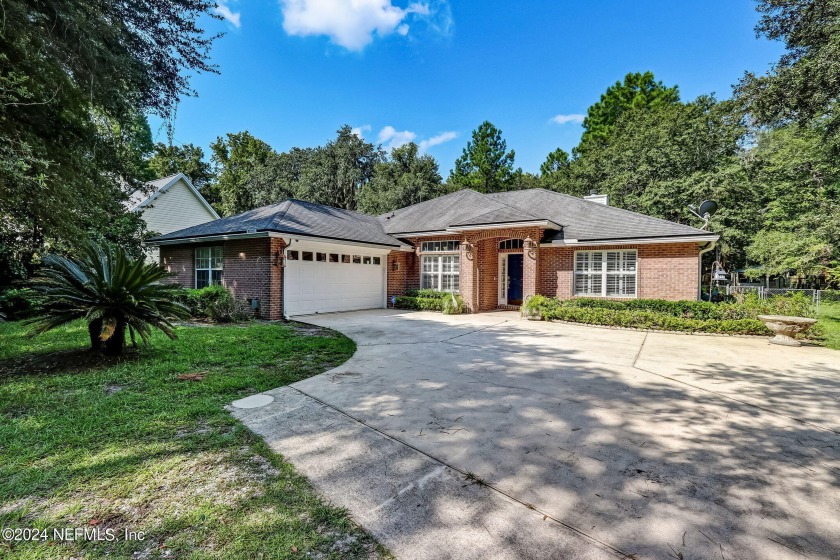 Charming WATERFRONT RETREAT on Lofton Creek! This exceptional - Beach Home for sale in Yulee, Florida on Beachhouse.com