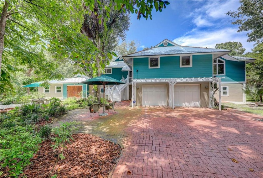 A lovely surprise awaits you down this long tree-lined drive.  A - Beach Home for sale in Dunedin, Florida on Beachhouse.com