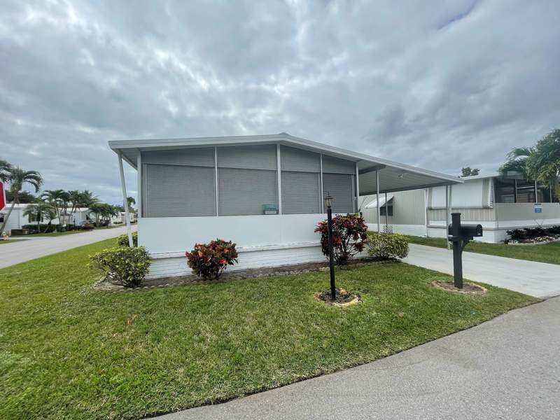Nestled on a picturesque corner lot, this delightful - Beach Home for sale in Deerfield Beach, Florida on Beachhouse.com