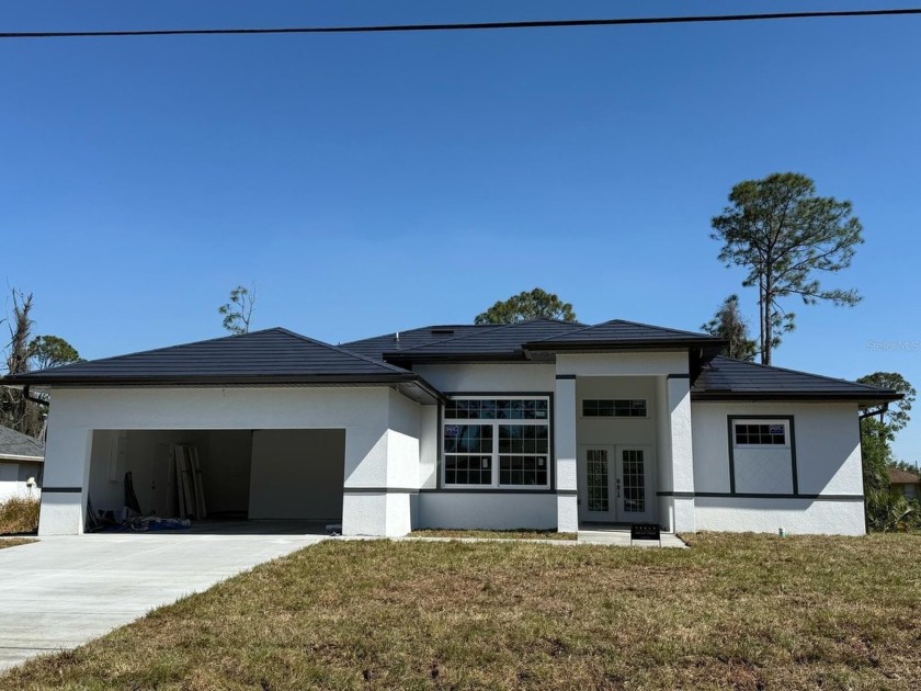 Stunning New Luxury Smart Home with Tesla Solar Roof - - Beach Home for sale in North Port, Florida on Beachhouse.com