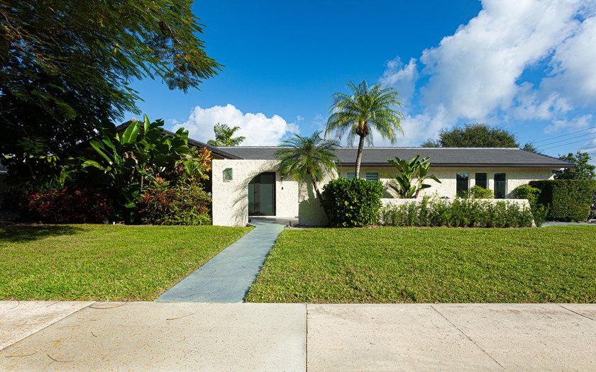 Tucked away on an oversized corner lot in the sought-after - Beach Home for sale in North Palm Beach, Florida on Beachhouse.com
