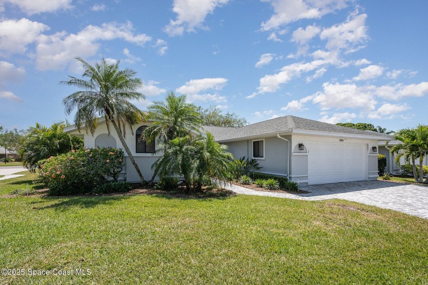 Gorgeous paver driveway and lush landscaping greet you as you - Beach Home for sale in Melbourne, Florida on Beachhouse.com