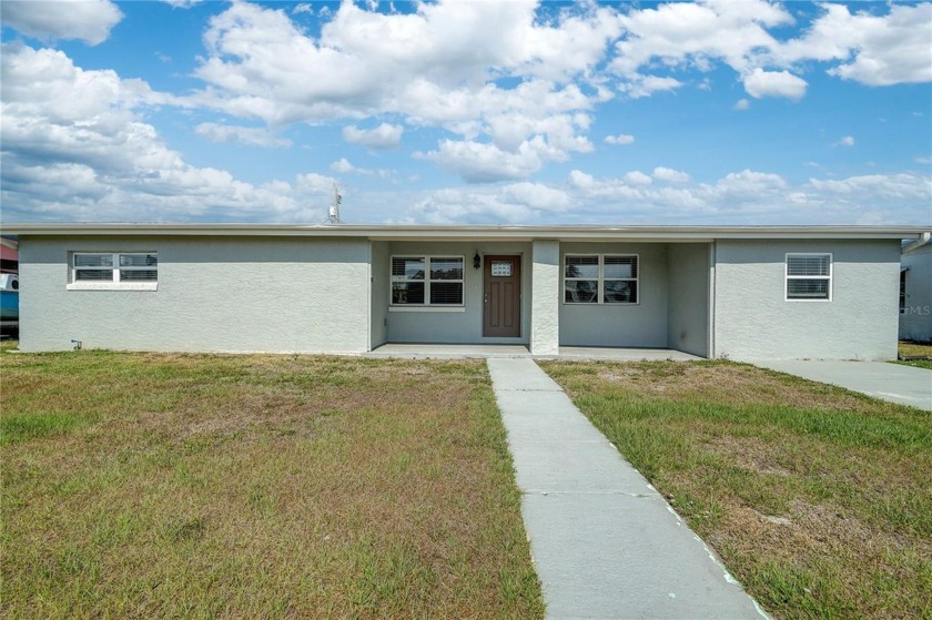 This beautifully updated residence offers modern living at its - Beach Home for sale in Port Charlotte, Florida on Beachhouse.com