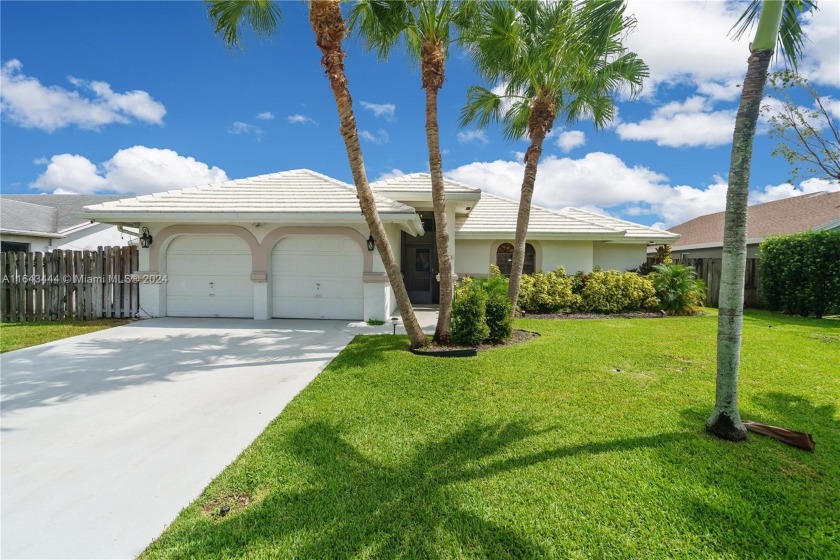 Welcome Home!! Nestled in the Woodmont Golf Club Community, this - Beach Home for sale in Tamarac, Florida on Beachhouse.com