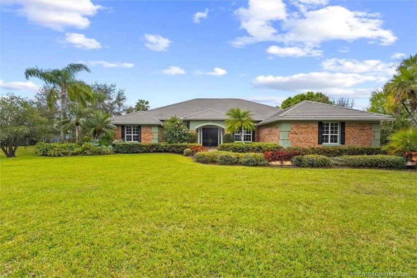 Welcome to your dream home in a prestigious guard gated golf - Beach Home for sale in Palm City, Florida on Beachhouse.com