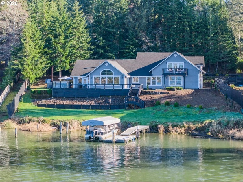 Lakefront living on Devils Lake with approximately 100' of - Beach Home for sale in Otis, Oregon on Beachhouse.com