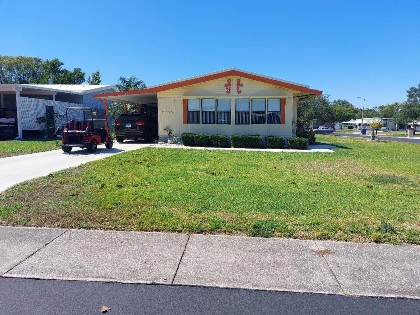 PRICED REDUCED...CORNER LOT..HIGH CELINGS...2BR-2BATH IN - Beach Home for sale in Palm Harbor, Florida on Beachhouse.com