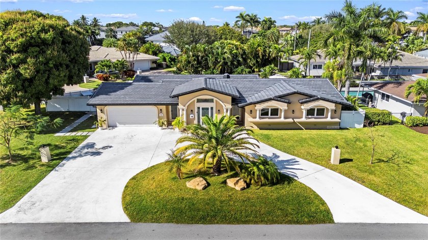 This exceptional Lighthouse Point retreat is gracefully set on - Beach Home for sale in Lighthouse Point, Florida on Beachhouse.com