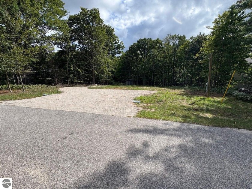 Perfectly located and ready for your dream home! Nestled in the - Beach Lot for sale in Onekama, Michigan on Beachhouse.com