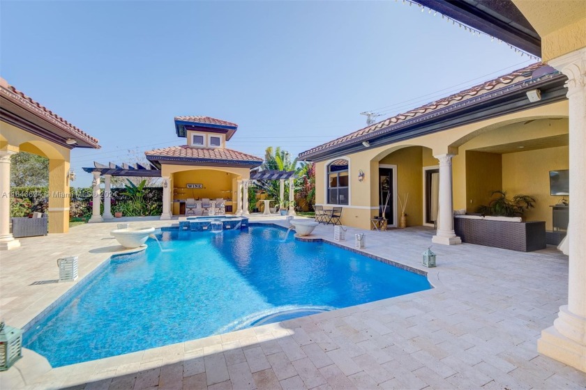 This Courtyard style home on 1.3 acreage was built for - Beach Home for sale in Davie, Florida on Beachhouse.com