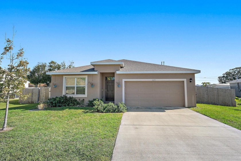 Welcome to this beautifully crafted 4-bedroom, 2-bathroom home - Beach Home for sale in Port Saint Lucie, Florida on Beachhouse.com