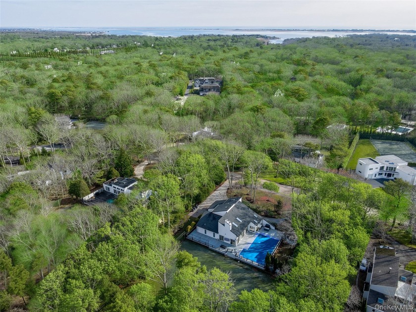 Ideally sited on a private one-acre lot in one of the most - Beach Home for sale in Quogue, New York on Beachhouse.com
