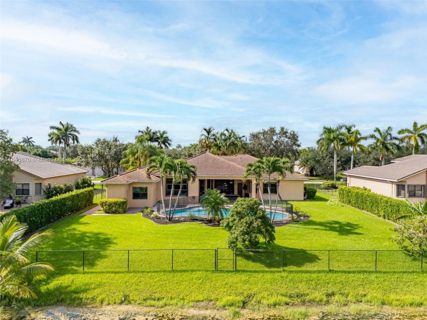 Step inside this beautiful lake front home in the highly sought - Beach Home for sale in Davie, Florida on Beachhouse.com