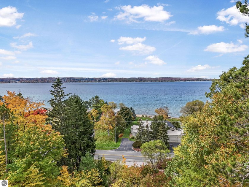 Set near the coveted base of Old Mission Peninsula, this - Beach Home for sale in Traverse City, Michigan on Beachhouse.com
