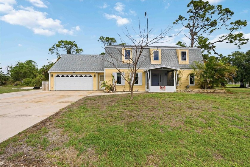 Cape Cod Charm on a Premier Half-Acre Double Corner Lot in Port - Beach Home for sale in Port Charlotte, Florida on Beachhouse.com