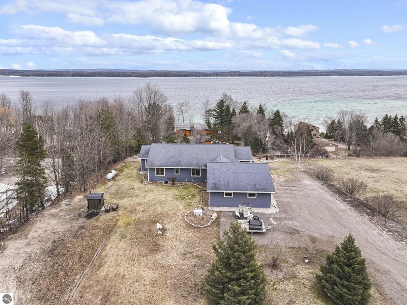 Panoramic Torch Lake views take center stage in this - Beach Home for sale in Kewadin, Michigan on Beachhouse.com