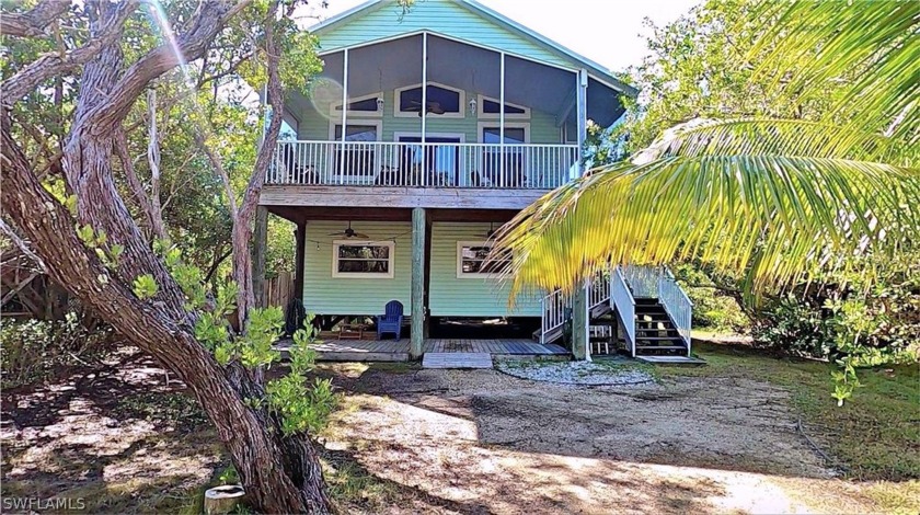 Island life awaits you! This charming 3 bed/2.5 bath stilt-style - Beach Home for sale in Placida, Florida on Beachhouse.com